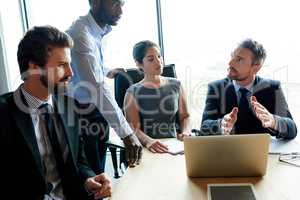 Thinking, talking and leadership team collaboration of business workers in a boardroom meeting. Serious office group work together on finance strategy. Corporate investment team working on a project