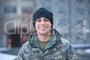 I joined the institute of heroes. a young soldier standing outside on a snowy day at military school.