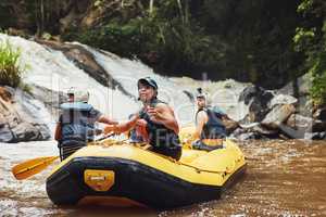 Do something that scares you. a group of friends out river rafting on a sunny day.