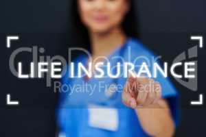 Life Insurance Do you have it. an unrecognizable female nurse using a touchscreen interface while standing against a black background.