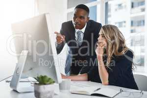 This might be a way of rapidly boosting our profits. two businesspeople working together in an office.