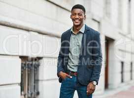 Stylish, trendy and handsome businessman walking to work in the city alone. Portrait of a cool black male entrepreneur commuting to his job and looking happy, carefree and cheerful in the morning