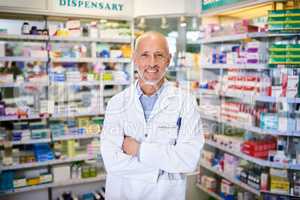Here to help give your health the boost it needs. Portrait of a mature pharmacist working in a chemist.