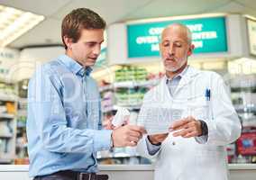 Youll need to renew this for next time. a handsome mature male pharmacist helping a customer in the pharmacy.