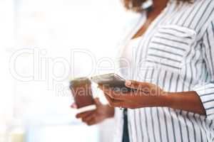 Creative checking social media on phone, texting or planning schedule while holding takeaway coffee. Closeup hands of marketing agent or woman managing startup website design and vision on technology