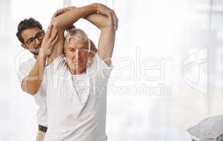 Your mobility seems good. a young male physiotherapist working with a senior male patient.