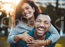 Fresh air really does wonders for happiness. Portrait of a young couple having fun together outdoors.