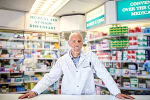How may I assist. Portrait of a mature pharmacist working in a chemist.