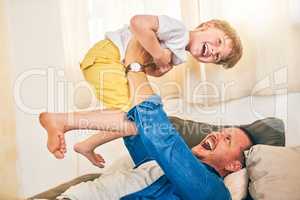 More than playtime, its bonding time. a happy little boy having fun with his father at home.