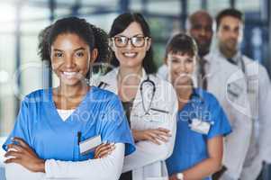 Your health is in our best interest. Portrait of a diverse team of doctors standing together in a hospital.