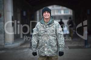 First day at military school, lets do this. a young soldier standing outside on a cold day at military school.