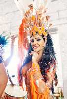 She embodies the spirit of samba. a beautiful samba dancer performing at a carnival.