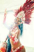 The undeniable seduction of samba. a beautiful samba dancer performing at a carnival.