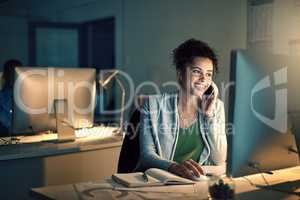 Shes been known to show true dedication at any hour. a young businesswoman working late in an office.