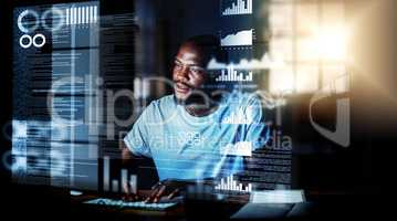 Computer programmer, software developer, or engineer working on computer database with futuristic CGI graphic data at night. Male information technology coder or a IT programmer coding cyber security