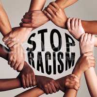 It stops with us. unrecognizable people linking arms and encircling the words stop racism against a gray background.