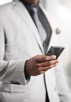 His gateway into keeping his lead in the business game. Closeup shot of an unrecognizable businessman using a cellphone.