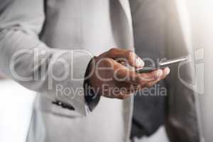 Making direct contact with new business opportunities. Closeup shot of an unrecognizable businessman using a cellphone.