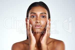 Dewy skin is the hallmark of healthy skin. Studio shot of a beautiful young woman posing against a light background.