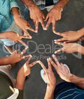 We are all stars is some form of way. High angle shot of an unrecognizable group of work colleagues forming an unique huddle with their fingers while standing in the office at work.