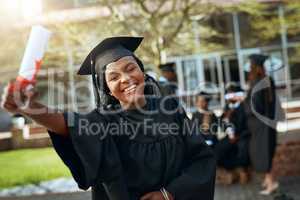 Im certified Hire me. Portrait of a happy young woman holding a diploma on graduation day.