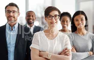 Smiling and modern team of business workers happy about teamwork collaboration and success. Portrait of successful office group ready to work. Colleagues standing together with a sense of community