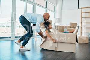 This house will never lack a sense of fun. a young couple having fun while moving house.