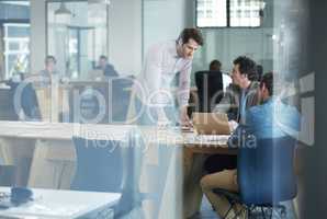 Thinking, talking and teamwork of serious business workers working together in a coworking office. Marketing team work on online content for a project. Colleagues planning a group collaboration