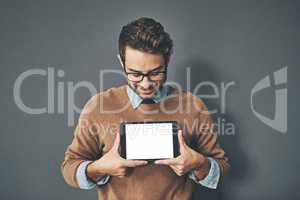 Person holding copyspace, blank and empty tablet screen with an internet app in studio against a grey background. Advertising, marketing and endorsing a product, service or website with copy space