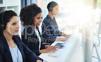 Every call is dealt with high professionalism. young women working in a call centre.
