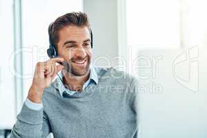 Ive got just the solution for you. a young call centre agent working in an office.