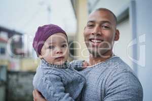 My baby boy, my blessing. Portrait of a father bonding with his little son outdoors.