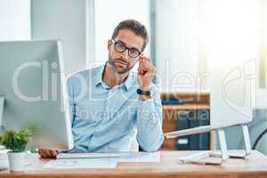 My eyes are set firmly on the prize. Portrait of a young businessman working in an office.