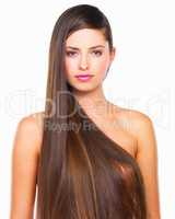 Theres a lot to love about her hair. Studio portrait of a beautiful young woman posing against a white background.
