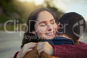 Happiness inspired by love. a happy young couple embracing each other outdoors.