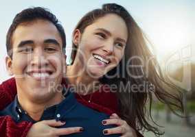 Im dating my dream girl. a happy young couple enjoying a piggyback ride outdoors.