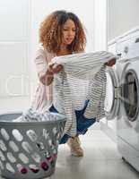 Oh no the stain wasnt removed. a young attractive woman doing laundry at home.