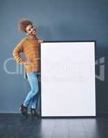 Sign, board and copyspace being held by a beautiful young woman for an advert. Attractive, smiling and happy female standing with a blank announcement to voice opinion. Lady with an empty poster.