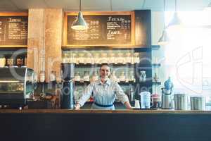 Glad to see youre back for some more. Portrait of a young woman working in a cafe.