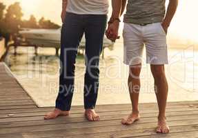 Our love and the sea are the same, never ending. an unrecognizable couple spending the day by the beach.