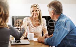 Financial advisor shaking hands with a female client after helping with budget, making a deal and planning with documents at home. Husband and wife paying for insurance and meeting with a consultant