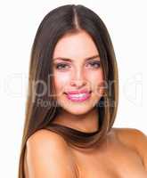 Perfect hair and a perfect smile. Studio portrait of a beautiful young woman posing against a white background.