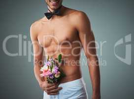 That was one crazy bachelor party. Studio shot of a handsome young shirtless man posing against a grey background.
