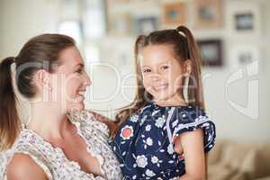 Her smile melts hearts. a mother and daughter spending time together at home.