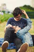 Our love is young but it will be everlasting. a teenage couple being affectionate outdoors.