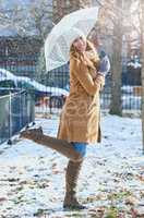 Dont fear the snow, go outside and enjoy it. an attractive young woman enjoying being out in the snow.