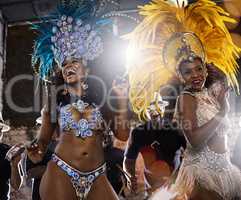 Let your whole body feel the beat. samba dancers performing in a carnival.
