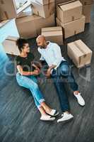 Taking a quick timeout during moving. a young couple taking a break while moving house.