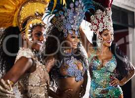Dressed to dazzle. samba dancers performing in a carnival.
