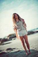 Life at the beach is simply blissful. an attractive young woman spending a day at the beach.